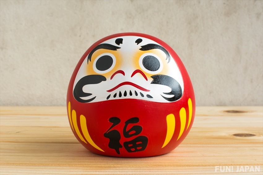 A lucky item that wards off evil and prevents illness and misfortune: Daruma doll